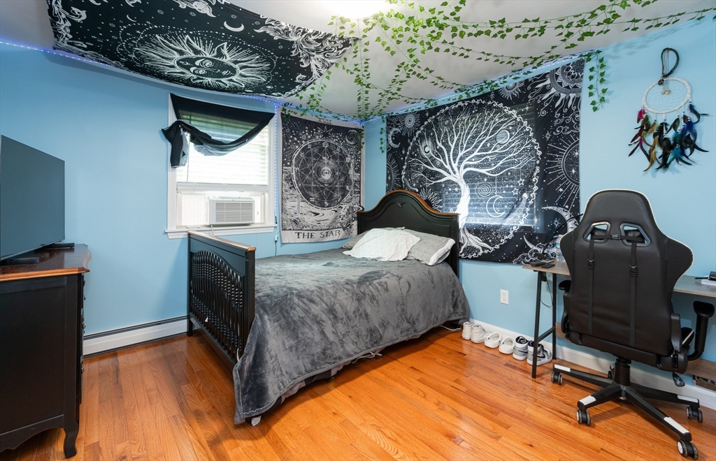 8 Jacques Lane Gloucester, MA 01930 - Photo 15 of 36 a bedroom with furniture and a fireplace