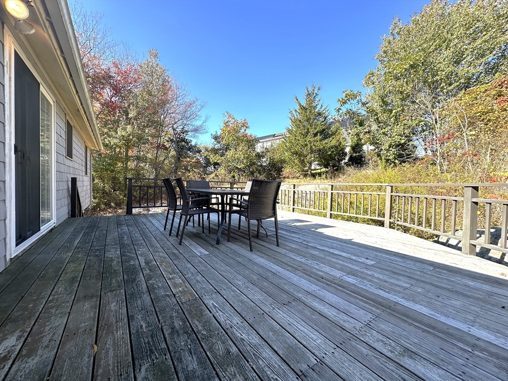 8 Jacques Lane Gloucester, MA 01930 - Photo 26 of 36 a view of a wooden deck with chairs