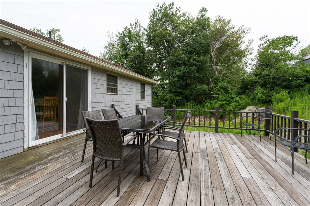 8 Jacques Lane Gloucester, MA 01930 - Photo 27 of 36 a view of backyard with a deck and wooden floor