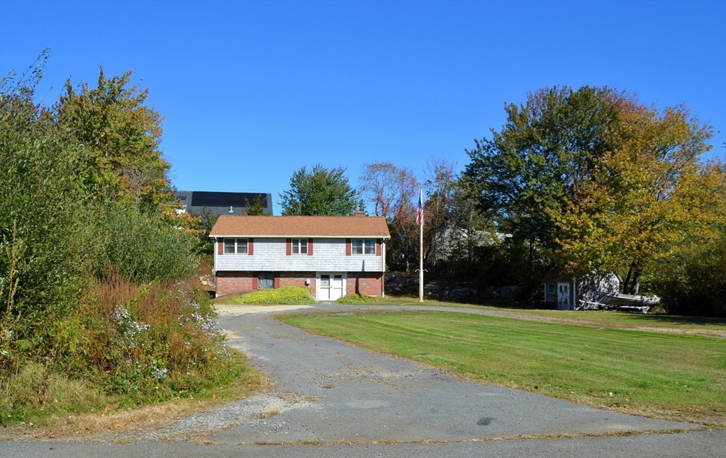 8 Jacques Lane Gloucester, MA 01930 - Photo 30 of 36 a view of a house with a yard