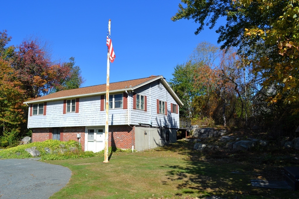 8 Jacques Lane Gloucester, MA 01930 - Photo 3 of 36 a house that has a tree in front of it