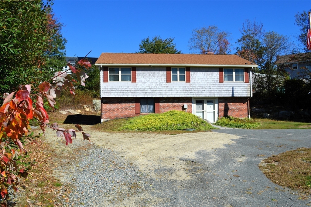 8 Jacques Lane Gloucester, MA 01930 - Photo 33 of 36 a front view of a house with a yard