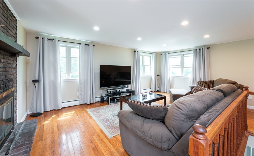 8 Jacques Lane Gloucester, MA 01930 - Photo 5 of 36 a living room with furniture and a flat screen tv