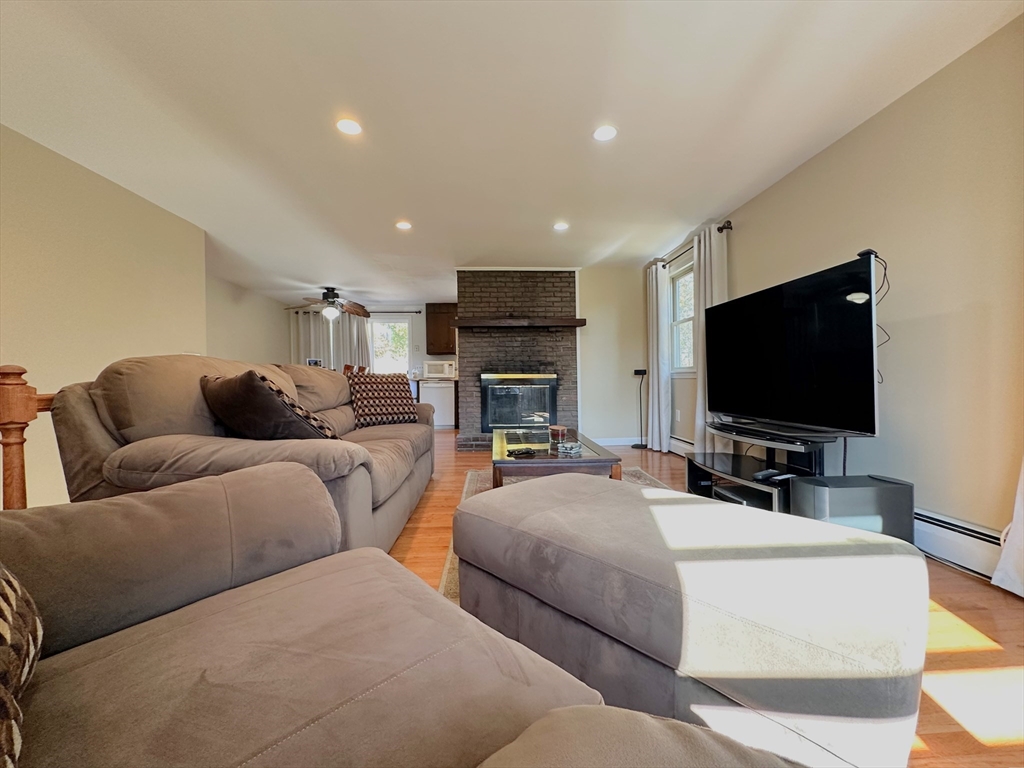 8 Jacques Lane Gloucester, MA 01930 - Photo 7 of 36 a living room with furniture and a flat screen tv