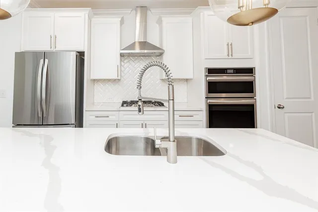 an empty room with windows and entrance