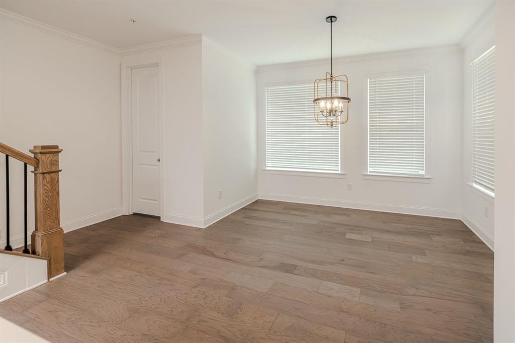 6595 Beacon Drive Atlanta, GA 30328 - Photo 19 of 36 an empty room with windows and entrance