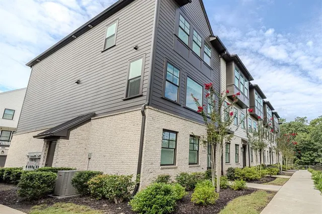 a view of a white building among the street