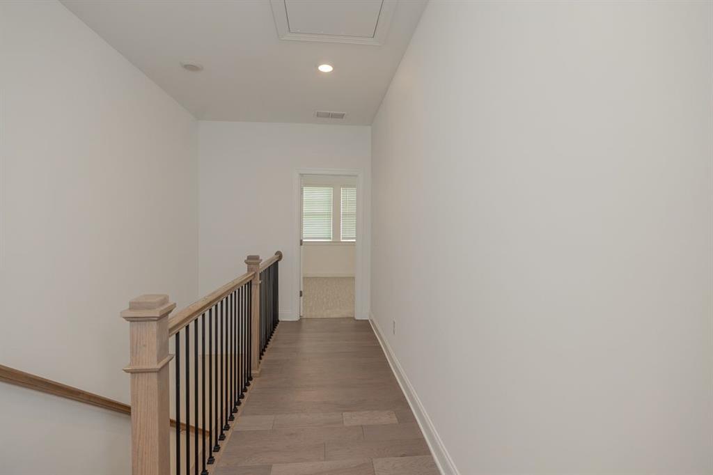6595 Beacon Drive Atlanta, GA 30328 - Photo 27 of 36 a view of a hallway with a window