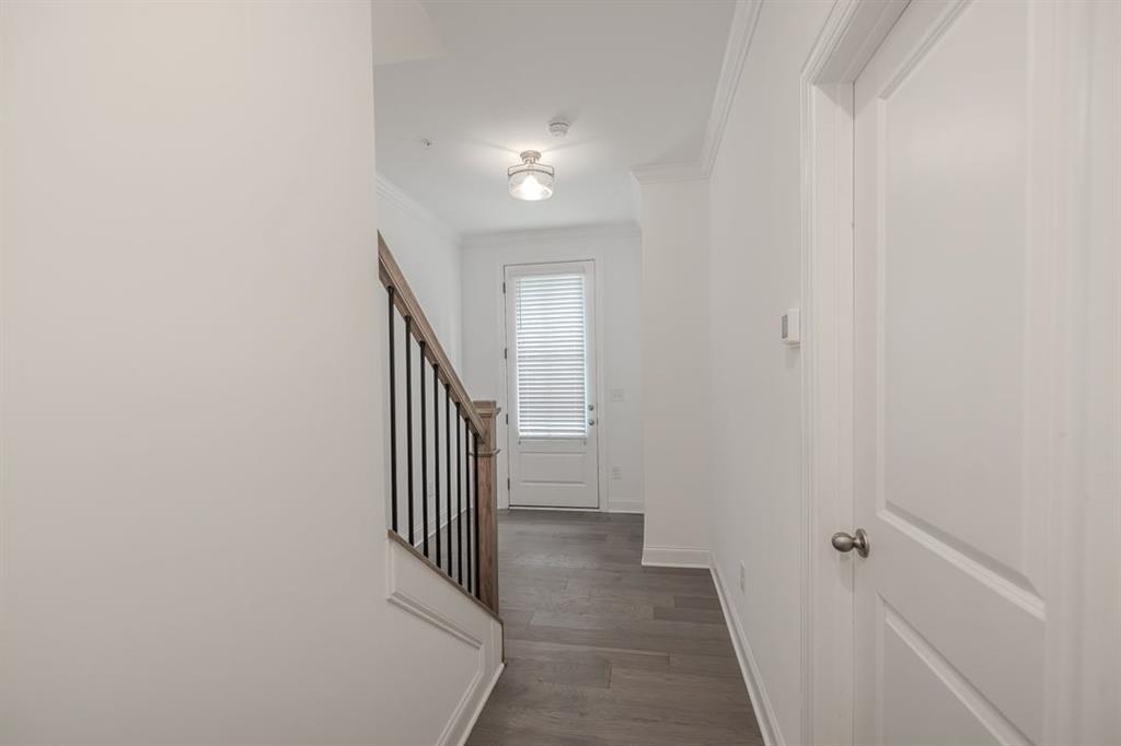 6595 Beacon Drive Atlanta, GA 30328 - Photo 5 of 36 a view of a hallway with staircase