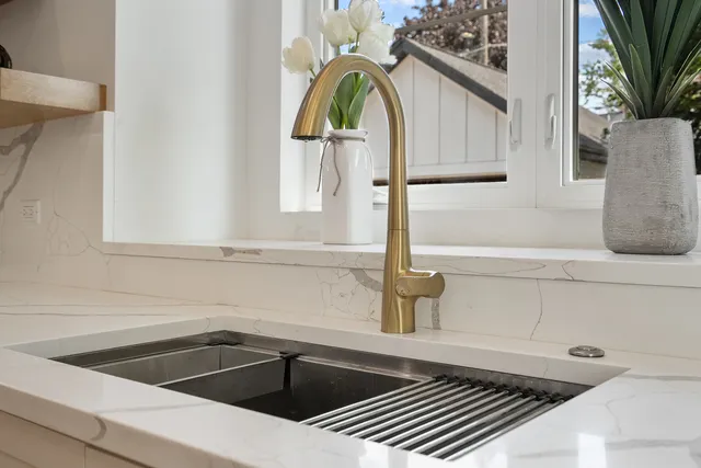 a kitchen with a sink and a window