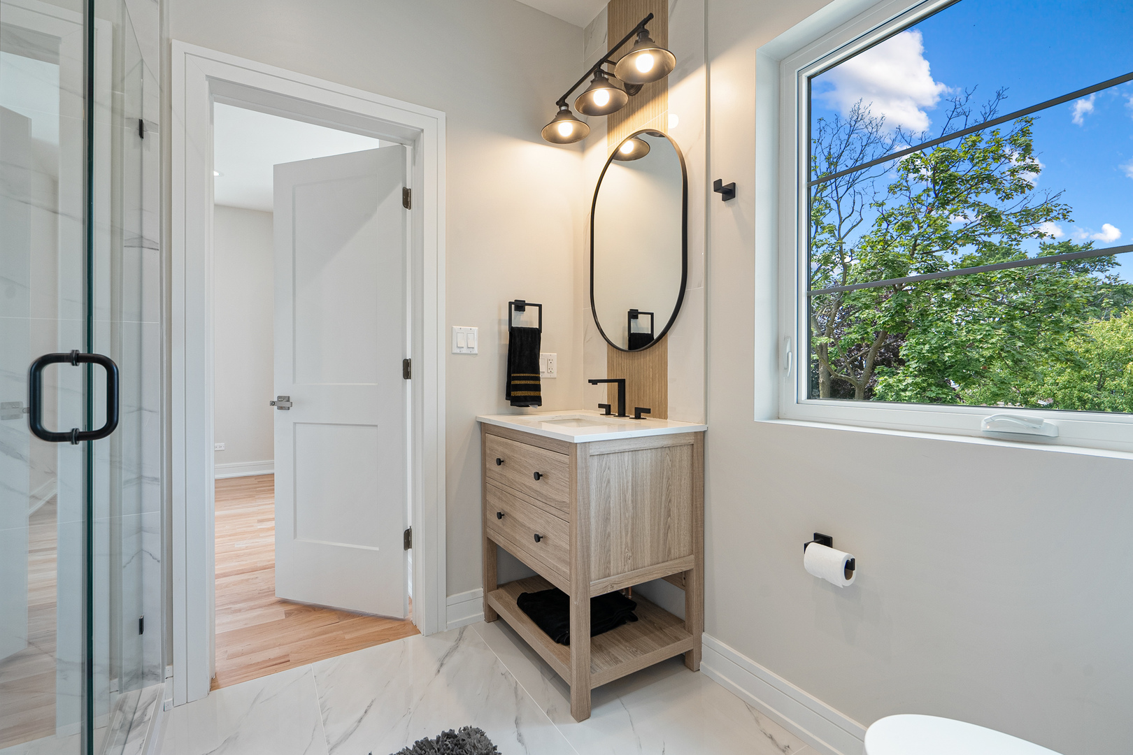 1705 South Prospect Avenue Park Ridge, IL 60068 - Photo 26 of 42 a bathroom with a sink a mirror a window and a shower