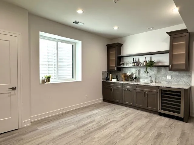 a kitchen with stainless steel appliances granite countertop a sink and cabinets