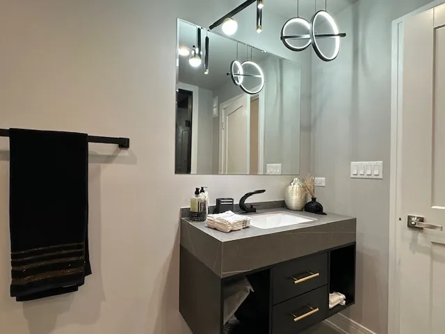 a bathroom with a sink and a mirror