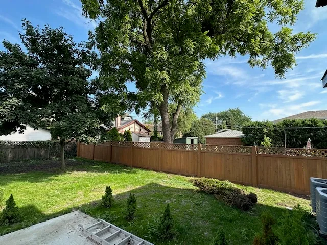 a backyard of a house with lots of green space