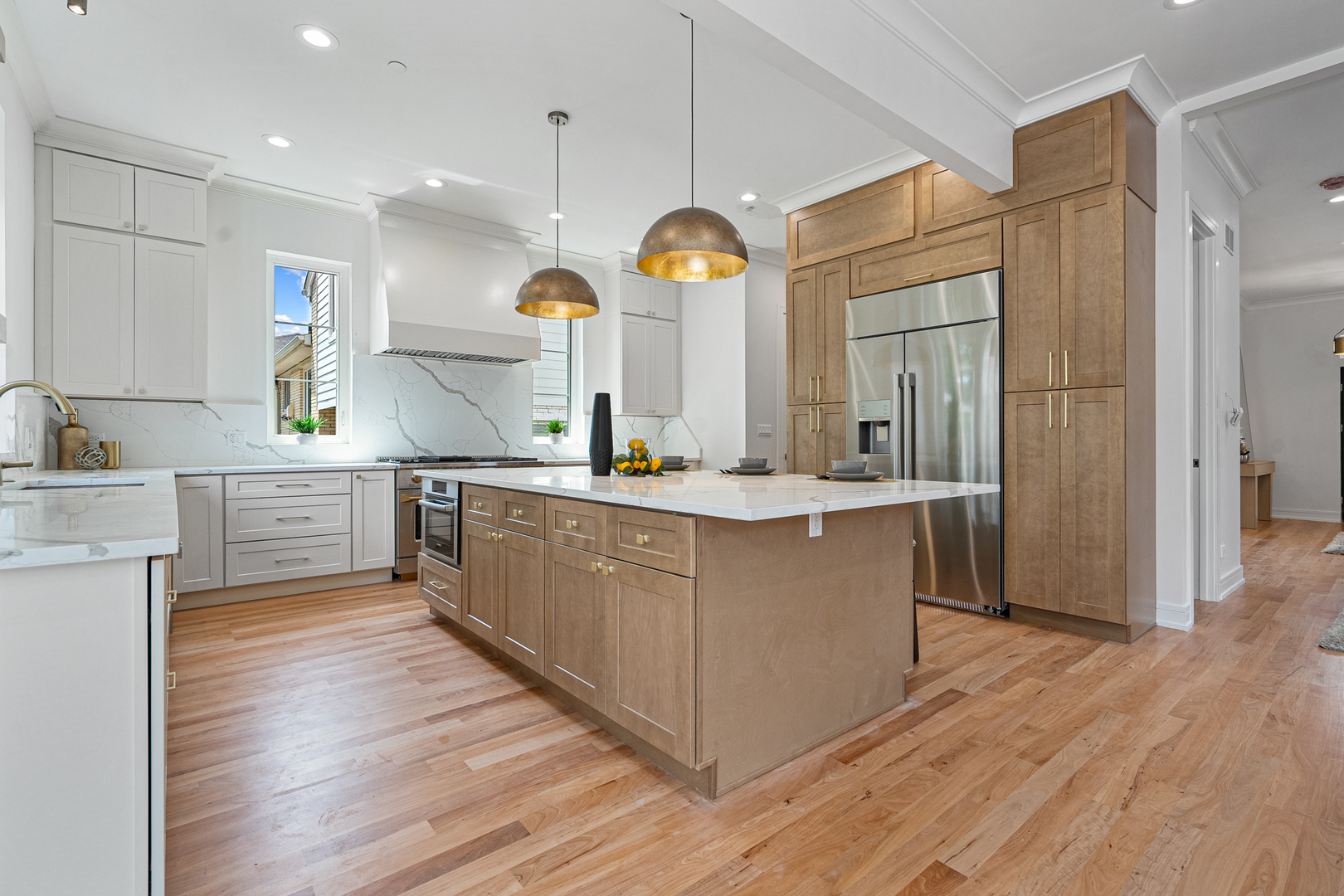 1705 South Prospect Avenue Park Ridge, IL 60068 - Photo 4 of 42 a large kitchen with kitchen island white cabinets and stainless steel appliances