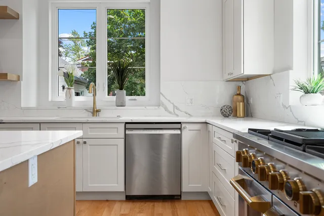 a kitchen with appliances cabinets and a sink