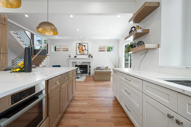 a large kitchen with lots of counter space and stainless steel appliances