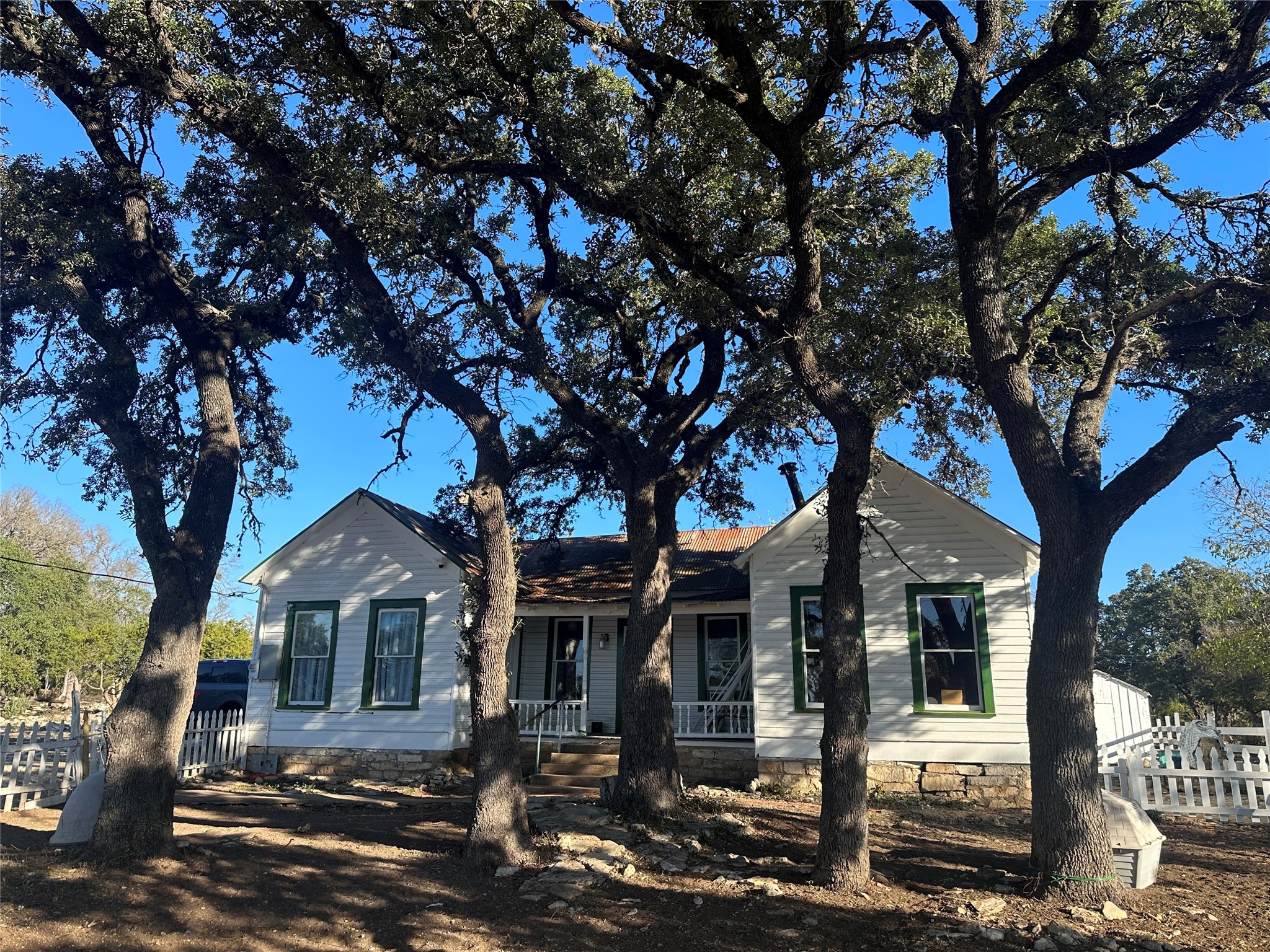 front view of a house with a tree