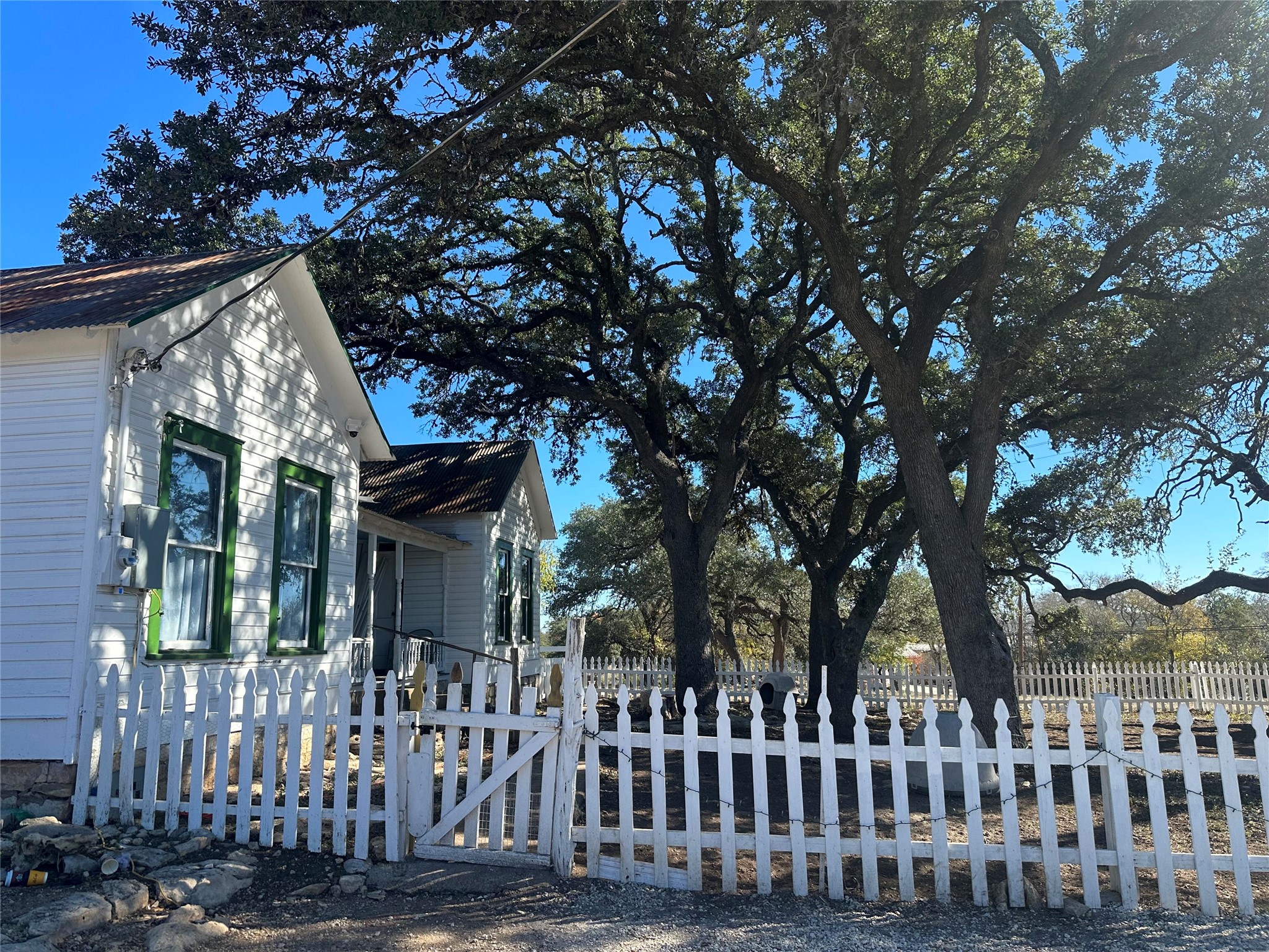 543 Narrows Road Blanco, TX 78606 - Photo 2 of 32 a view of a house with a tree