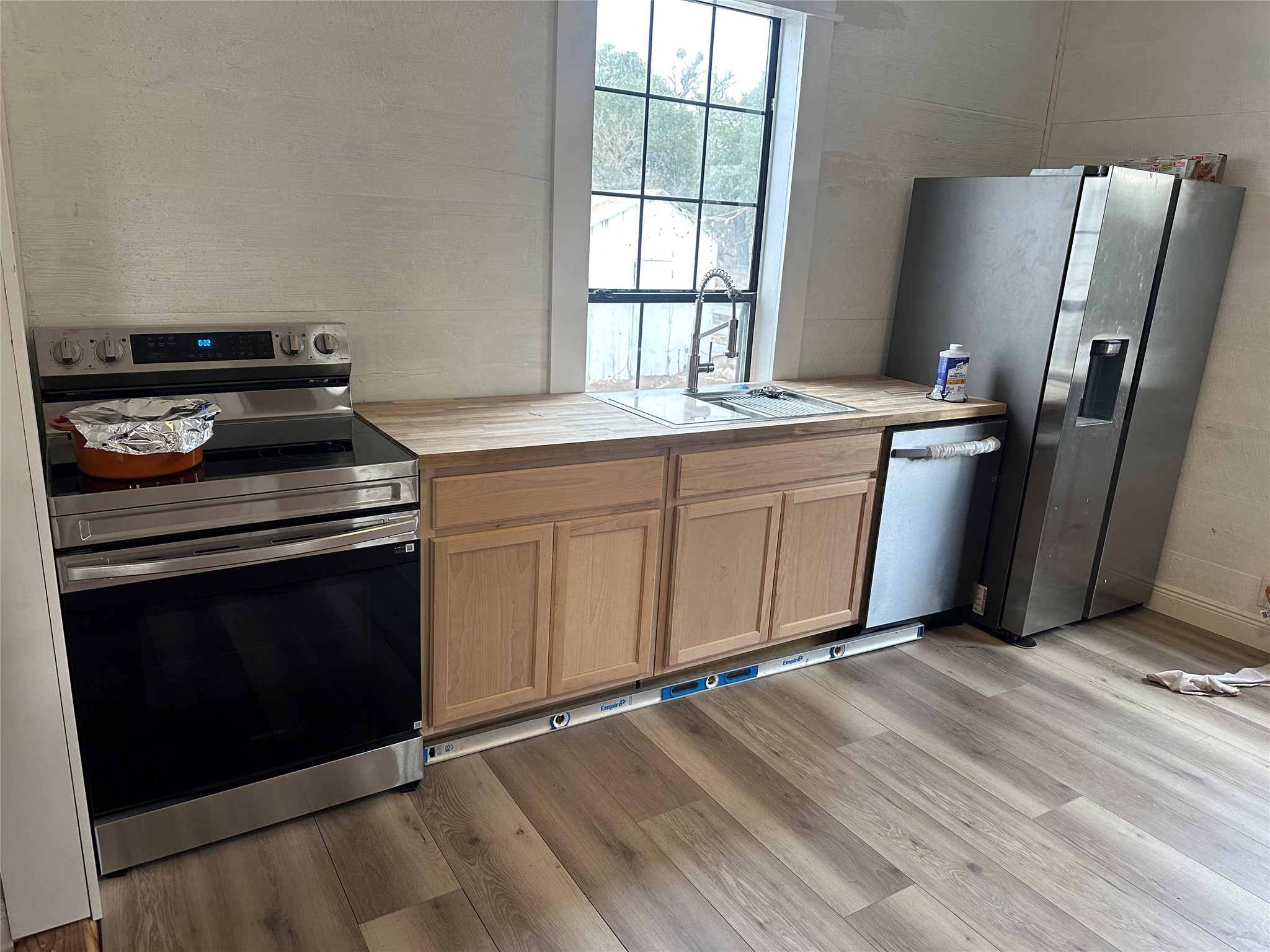 543 Narrows Road Blanco, TX 78606 - Photo 29 of 32 a kitchen with stainless steel appliances granite countertop a stove a refrigerator and a sink
