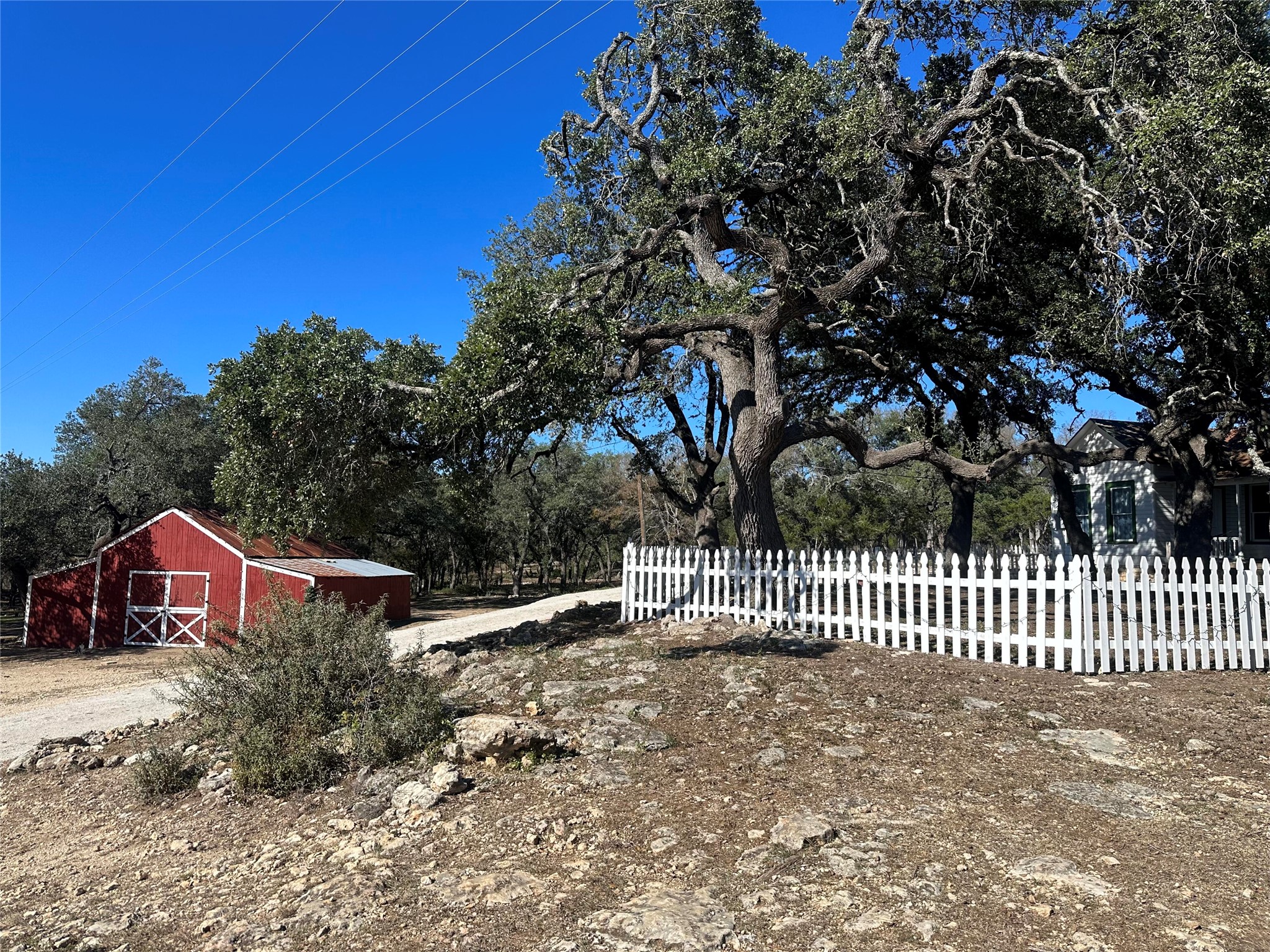 543 Narrows Road Blanco, TX 78606 - Photo 4 of 32 a view of houses with wooden fence