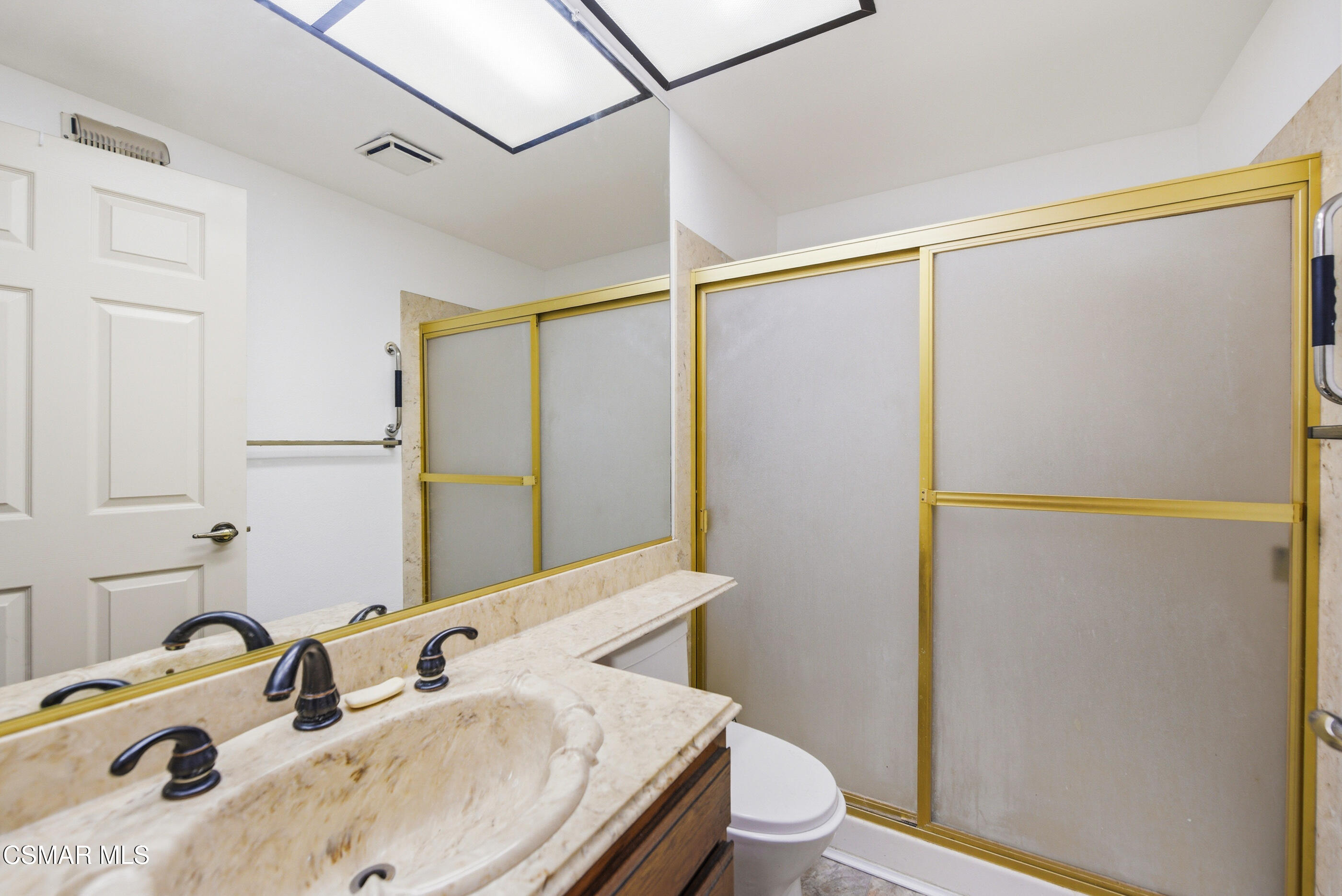 12036 Shadow Ridge Way Porter Ranch, CA 91326 - Photo 20 of 35 a bathroom with a sink and a mirror