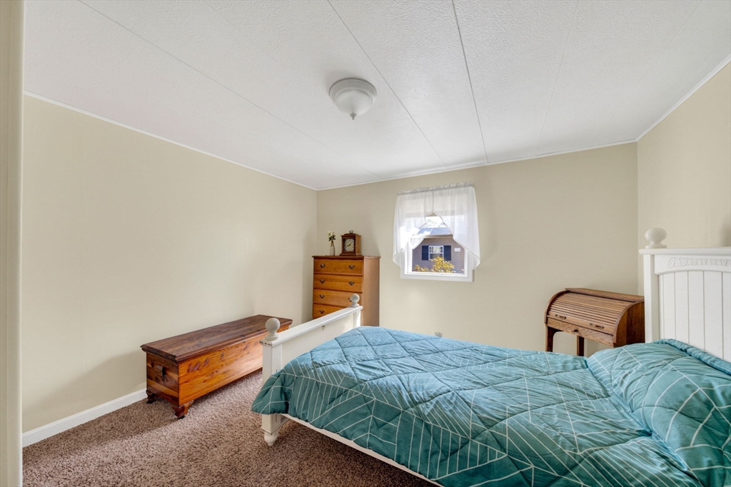 19 Timber Lane Wareham, MA 02571 - Photo 19 of 38 a bedroom with a bed and a window