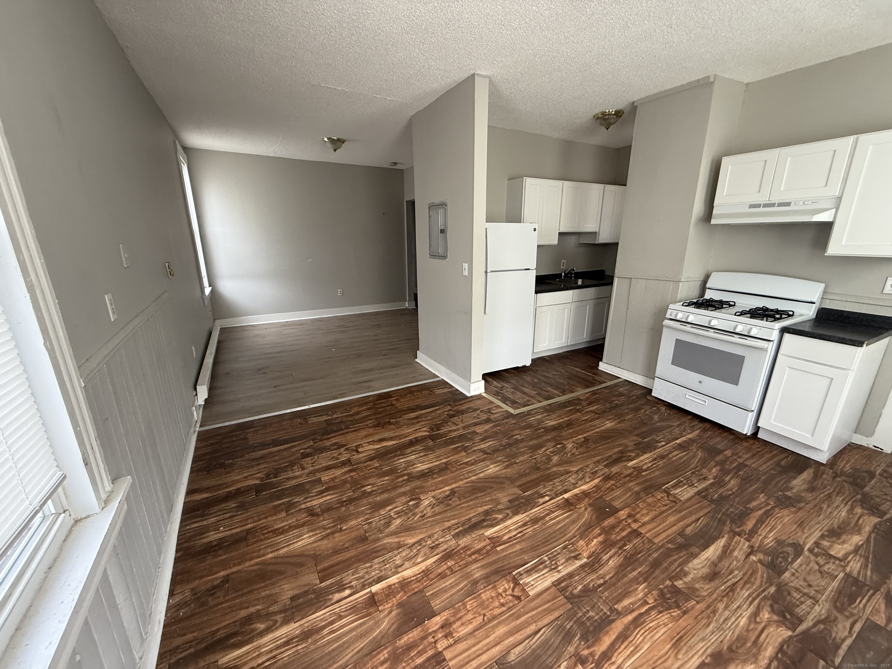 40 Shelton Avenue New Haven, CT 06511 - Photo 11 of 13 a kitchen with granite countertop a refrigerator and a stove