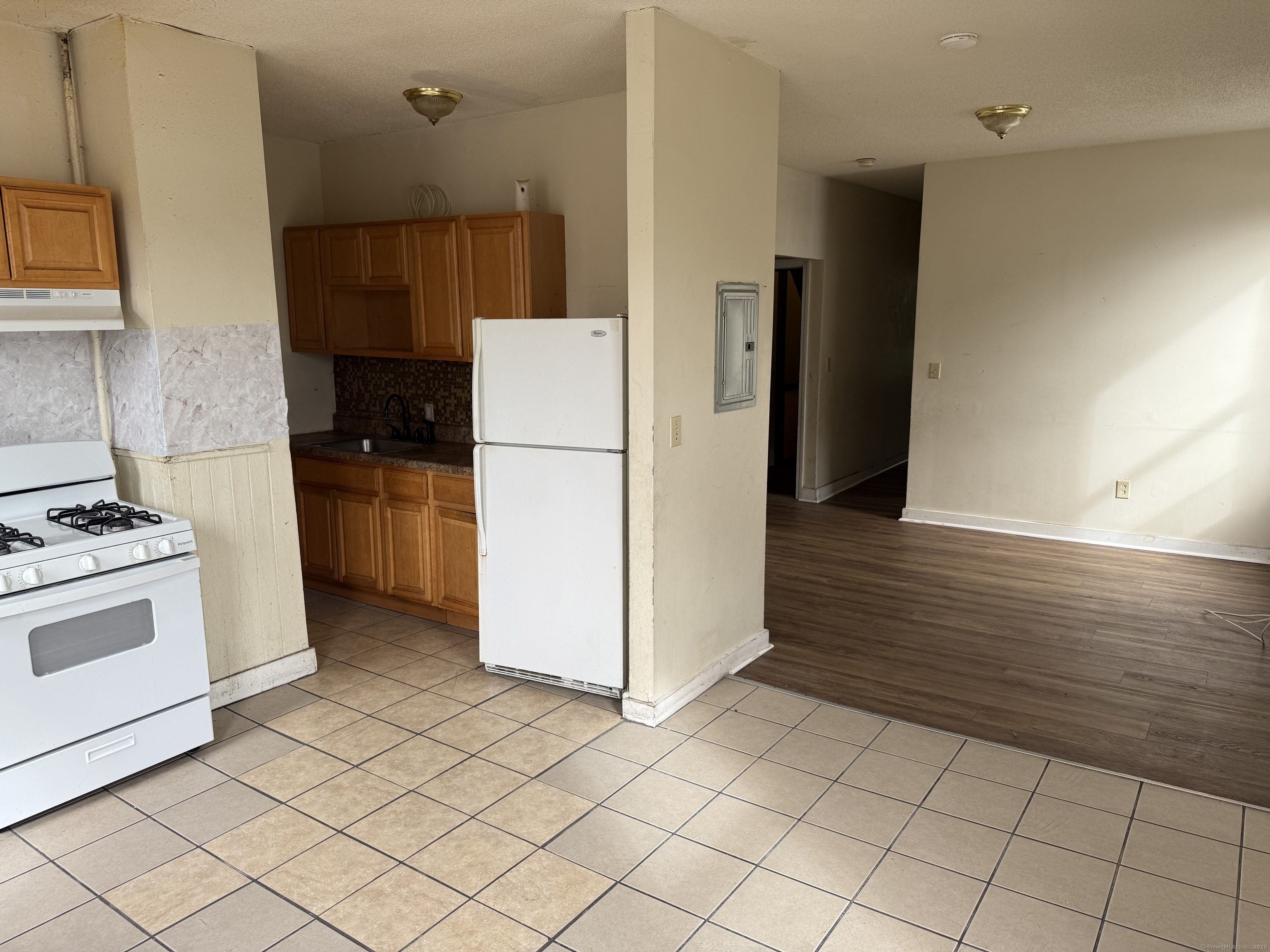 40 Shelton Avenue New Haven, CT 06511 - Photo 12 of 13 a kitchen with a refrigerator sink stove and cabinets