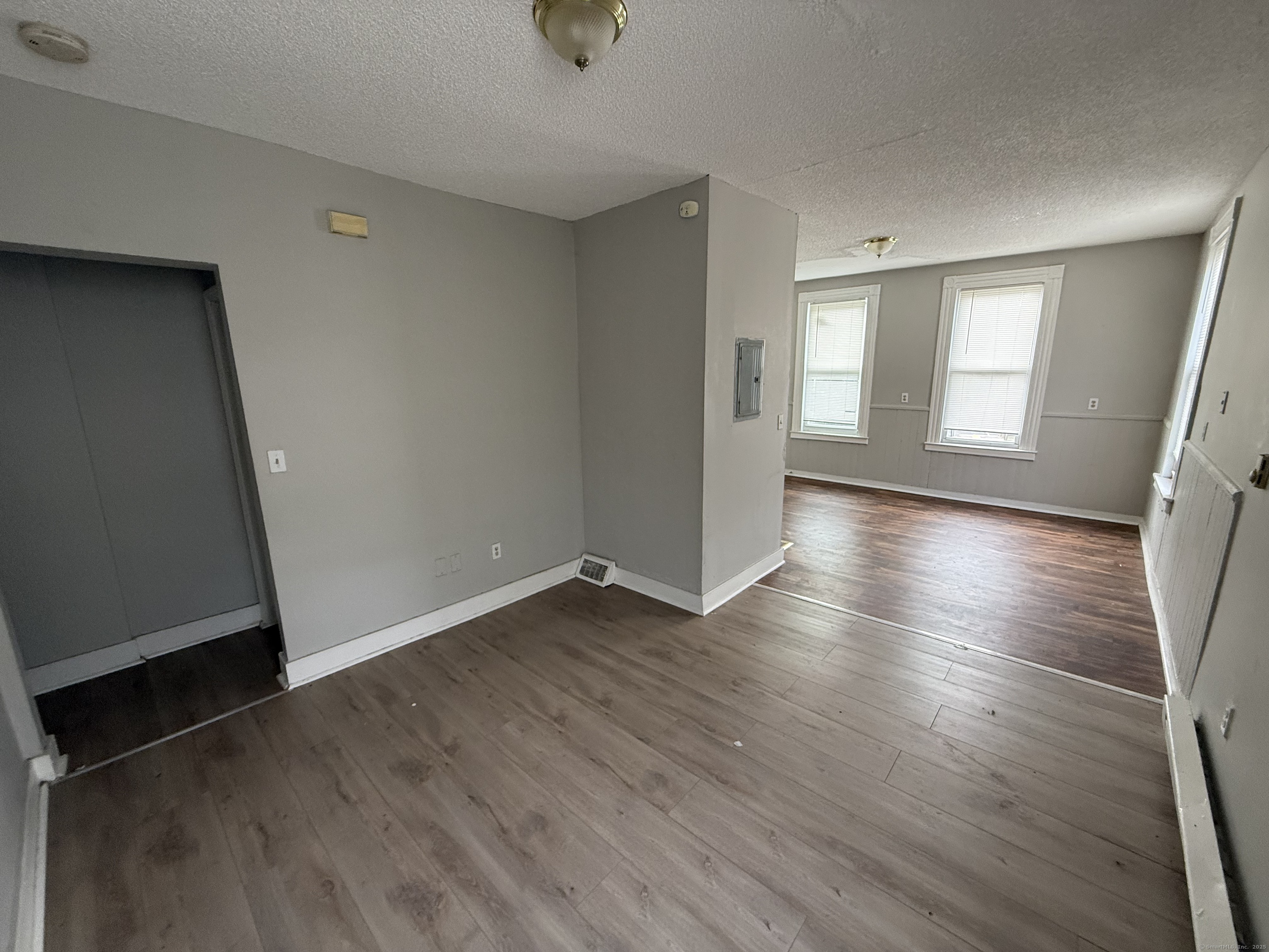 40 Shelton Avenue New Haven, CT 06511 - Photo 3 of 13 an empty room with wooden floor and windows