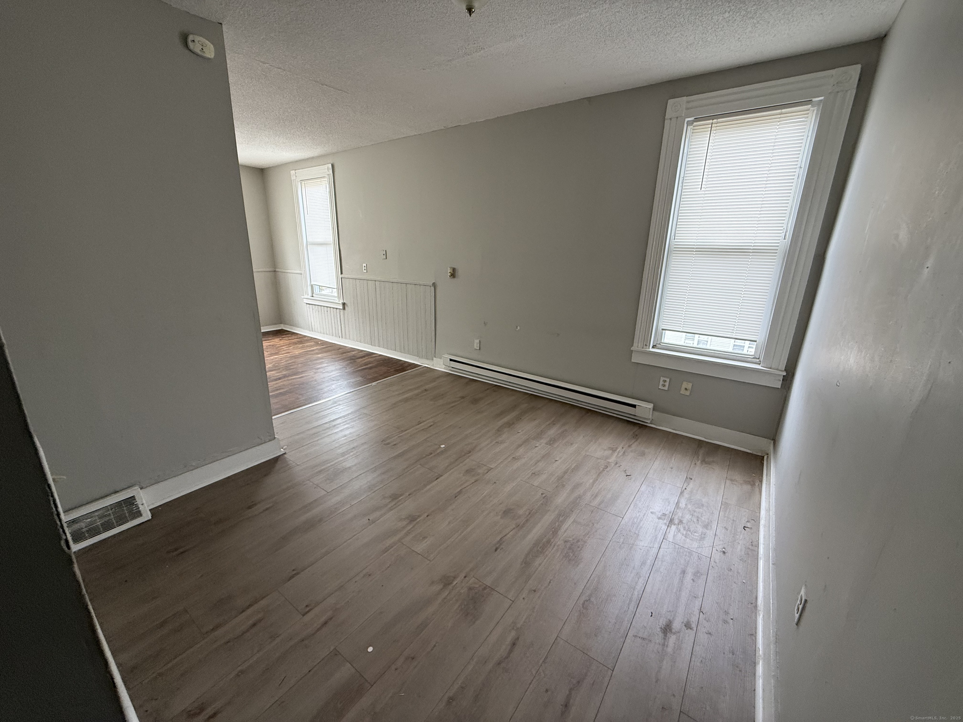40 Shelton Avenue New Haven, CT 06511 - Photo 4 of 13 an empty room with wooden floor and windows