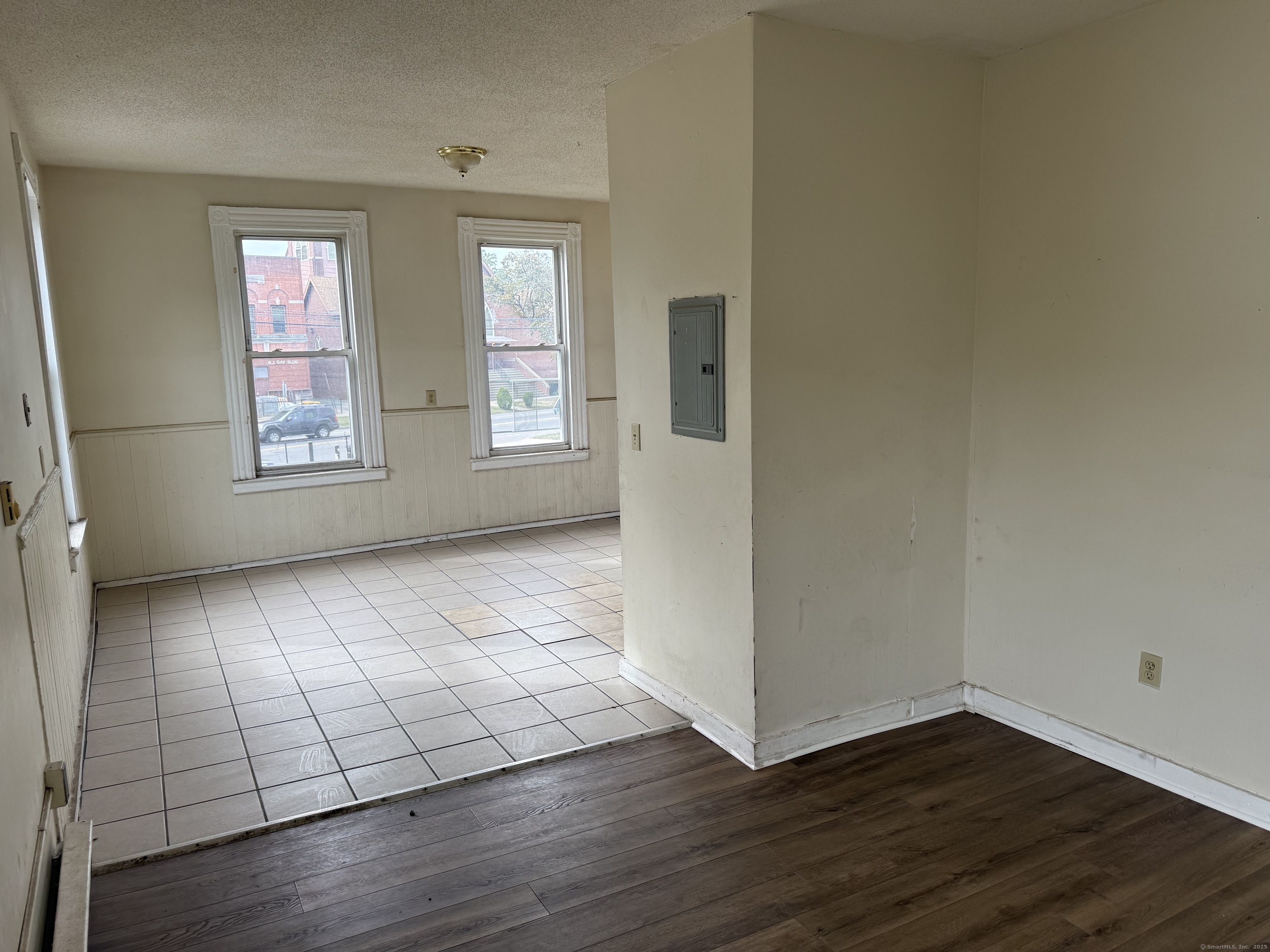 40 Shelton Avenue New Haven, CT 06511 - Photo 6 of 13 an empty room with wooden floor and windows