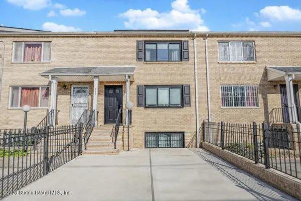 a view of front door of house with stairs