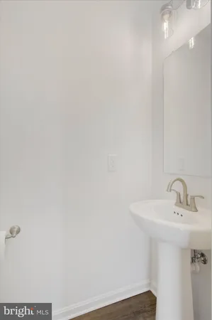 a bathroom with a sink and mirror