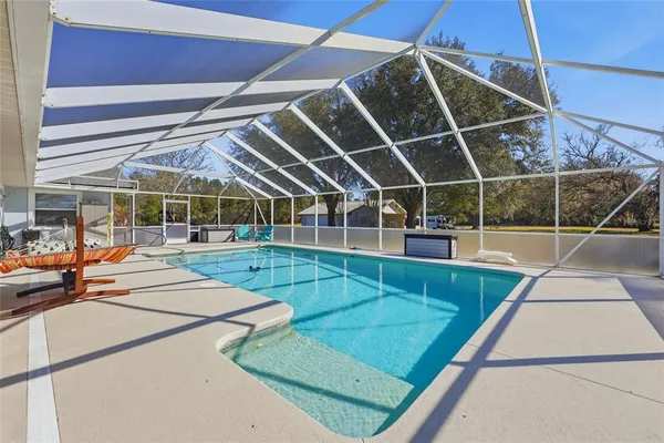 a view of a backyard with seating area