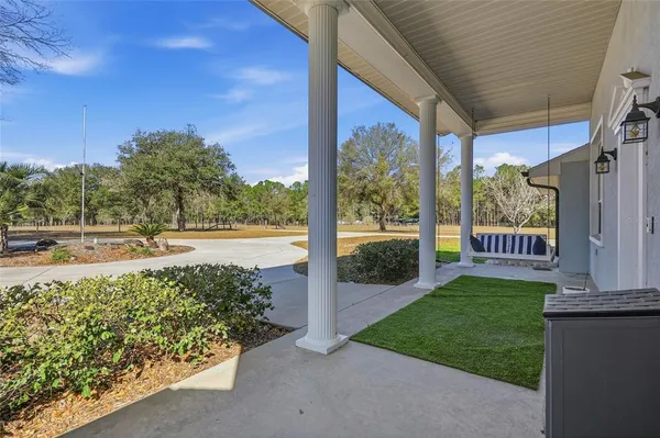 a view of a porch with a backyard