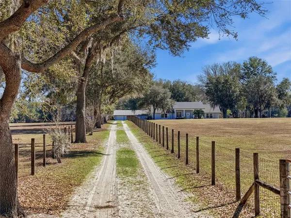 a view of swimming pool with a patio