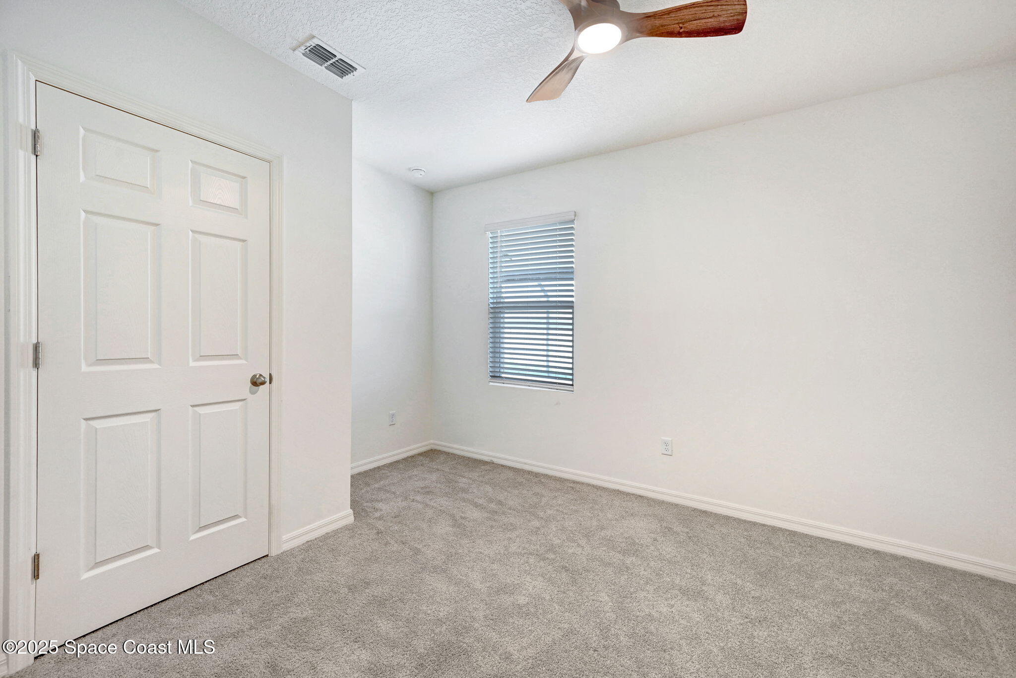 1217 Casey Avenue Rockledge, FL 32955 - Photo 18 of 49 an empty room with windows