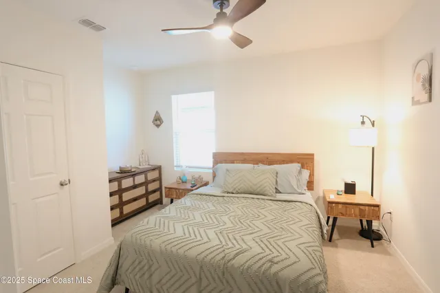 a bedroom with a bed and a table