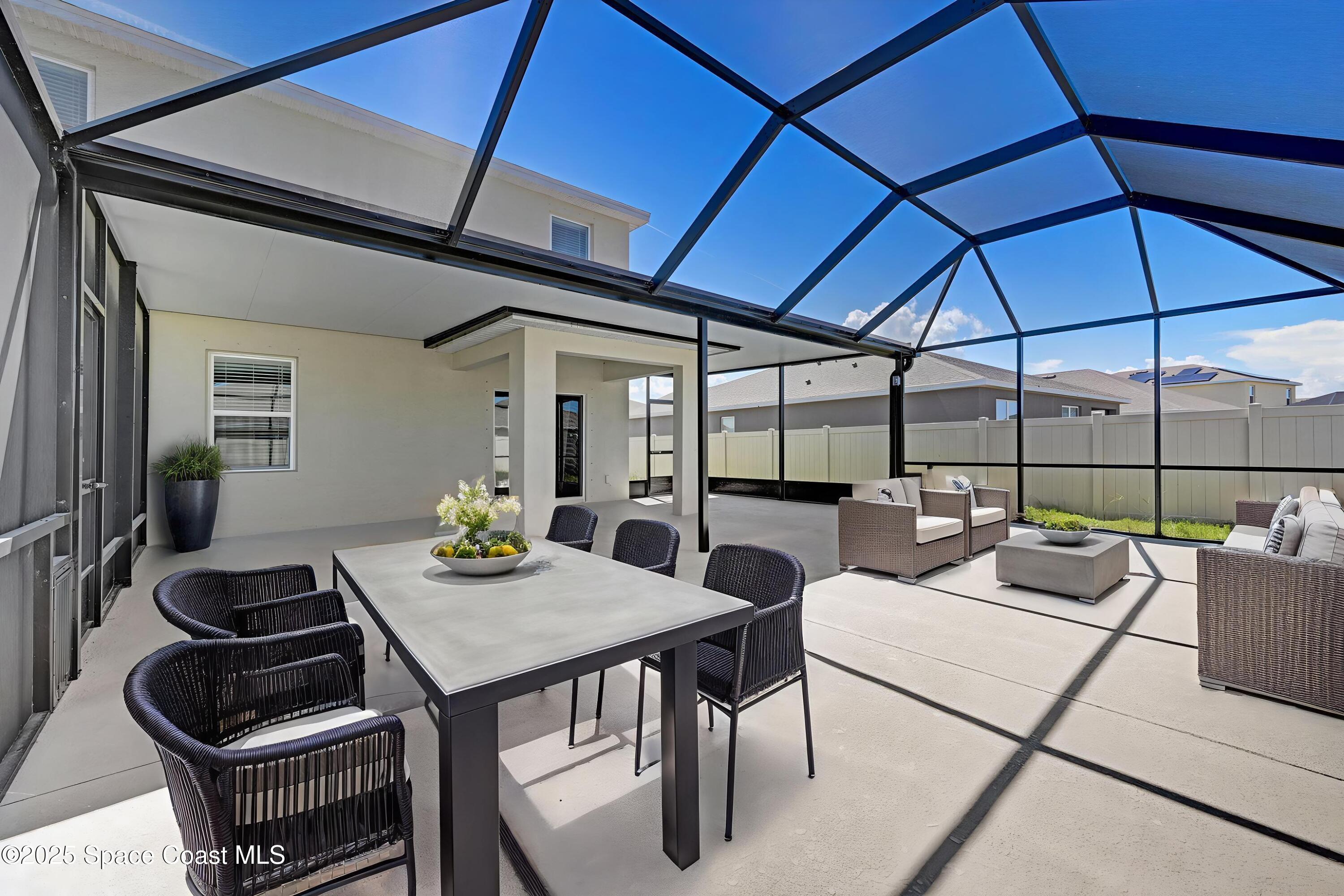 1217 Casey Avenue Rockledge, FL 32955 - Photo 3 of 49 a view of a dining room with furniture and chandelier