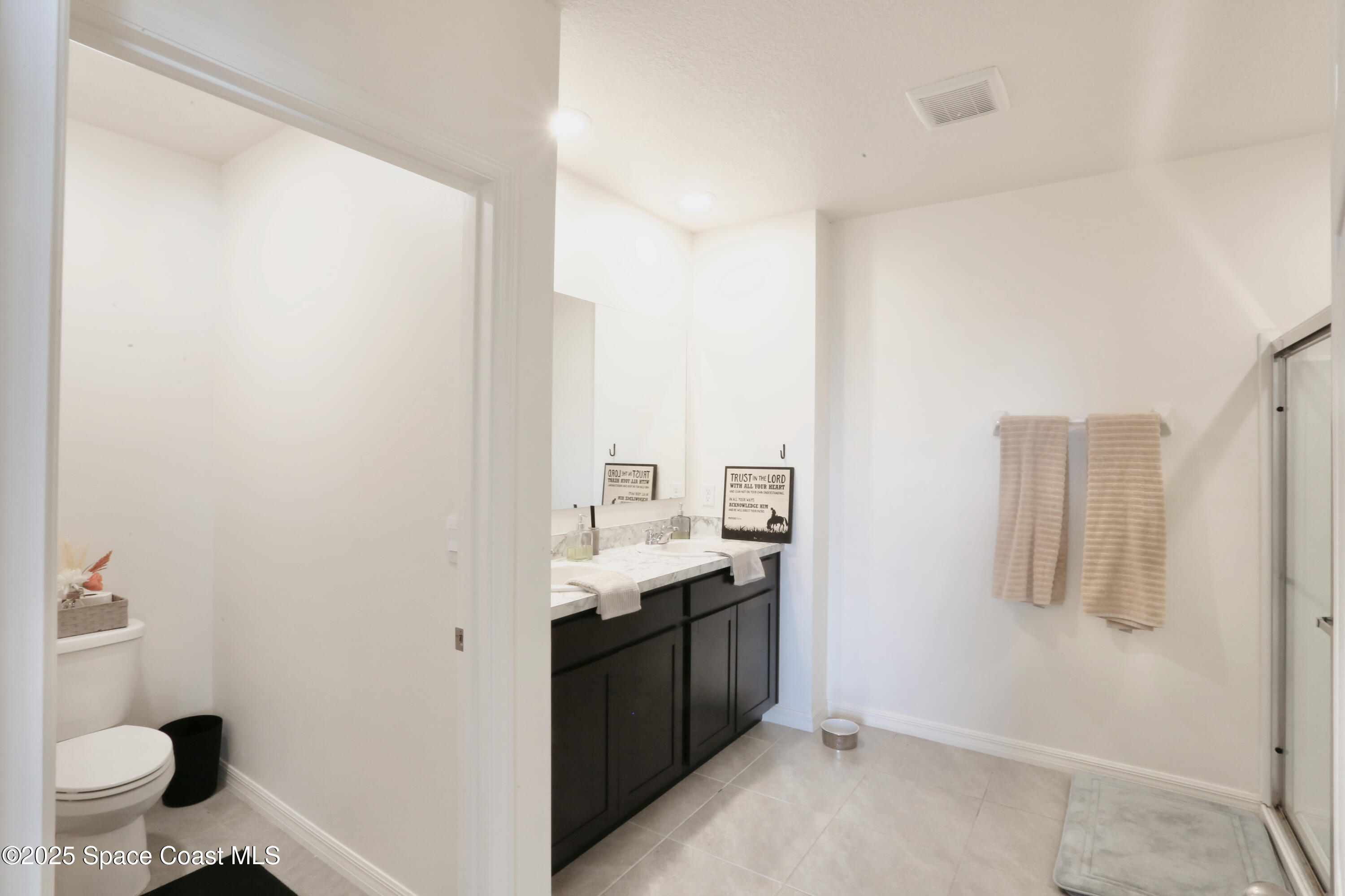 1217 Casey Avenue Rockledge, FL 32955 - Photo 31 of 49 a view of a bathroom with a sink and a toilet