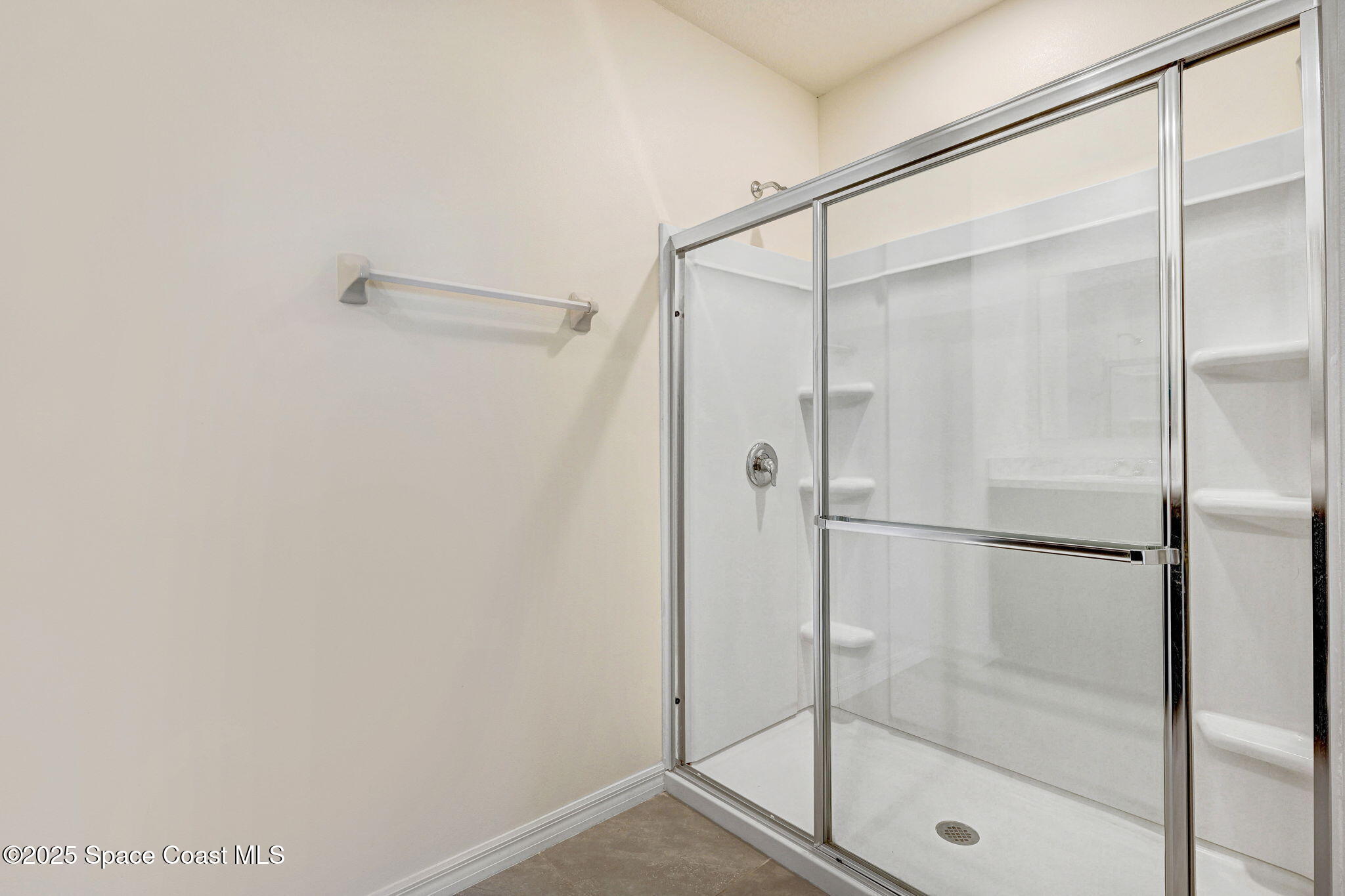 1217 Casey Avenue Rockledge, FL 32955 - Photo 32 of 49 a bathroom with a glass shower door
