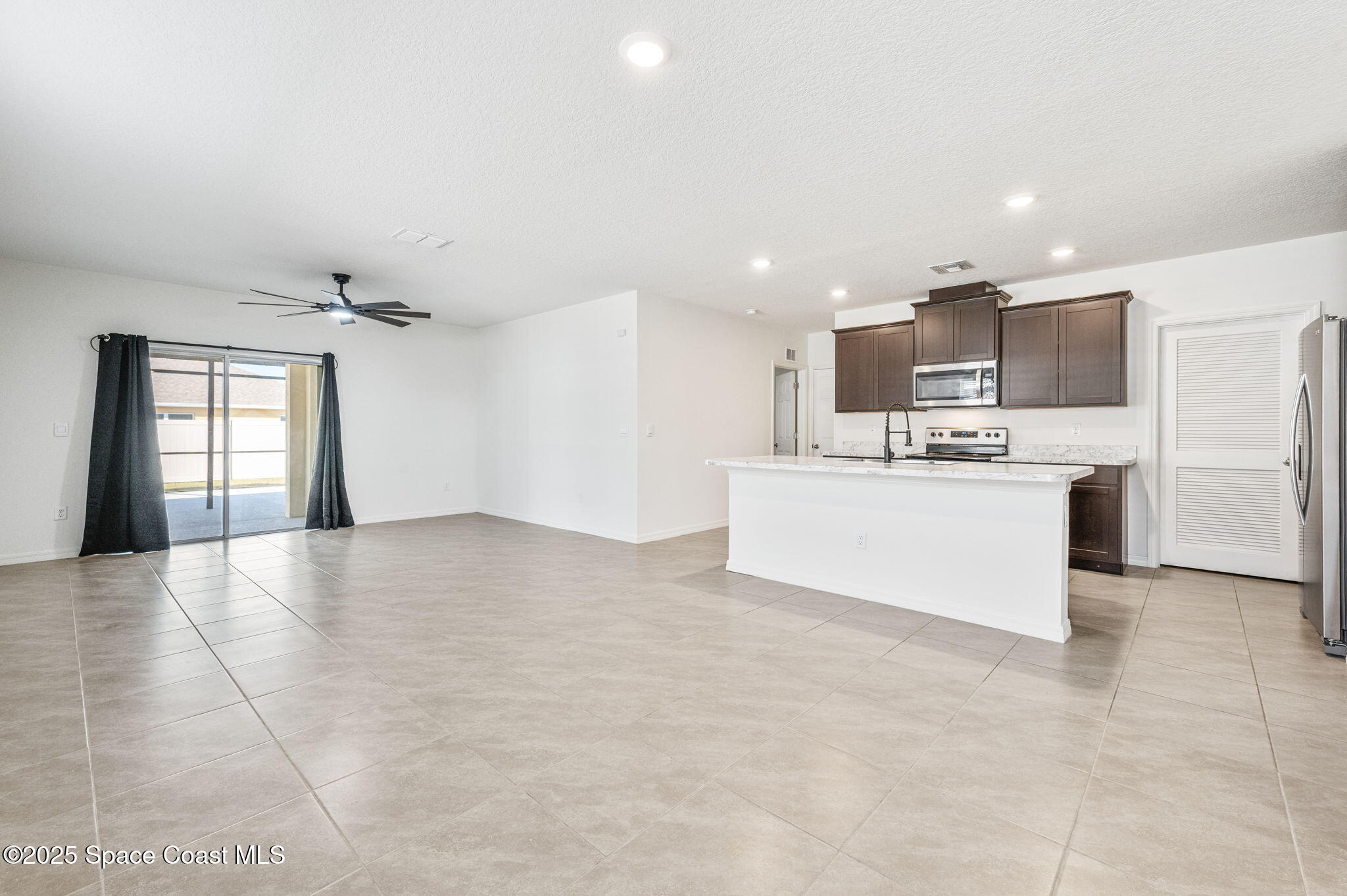 1217 Casey Avenue Rockledge, FL 32955 - Photo 4 of 49 a view of kitchen with kitchen island and stainless steel appliances