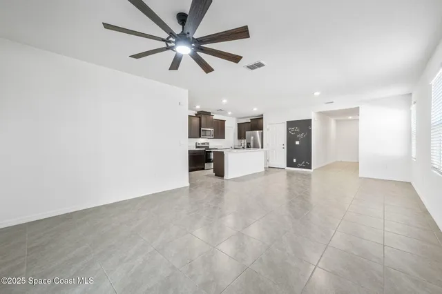 a view of a livingroom with a kitchen