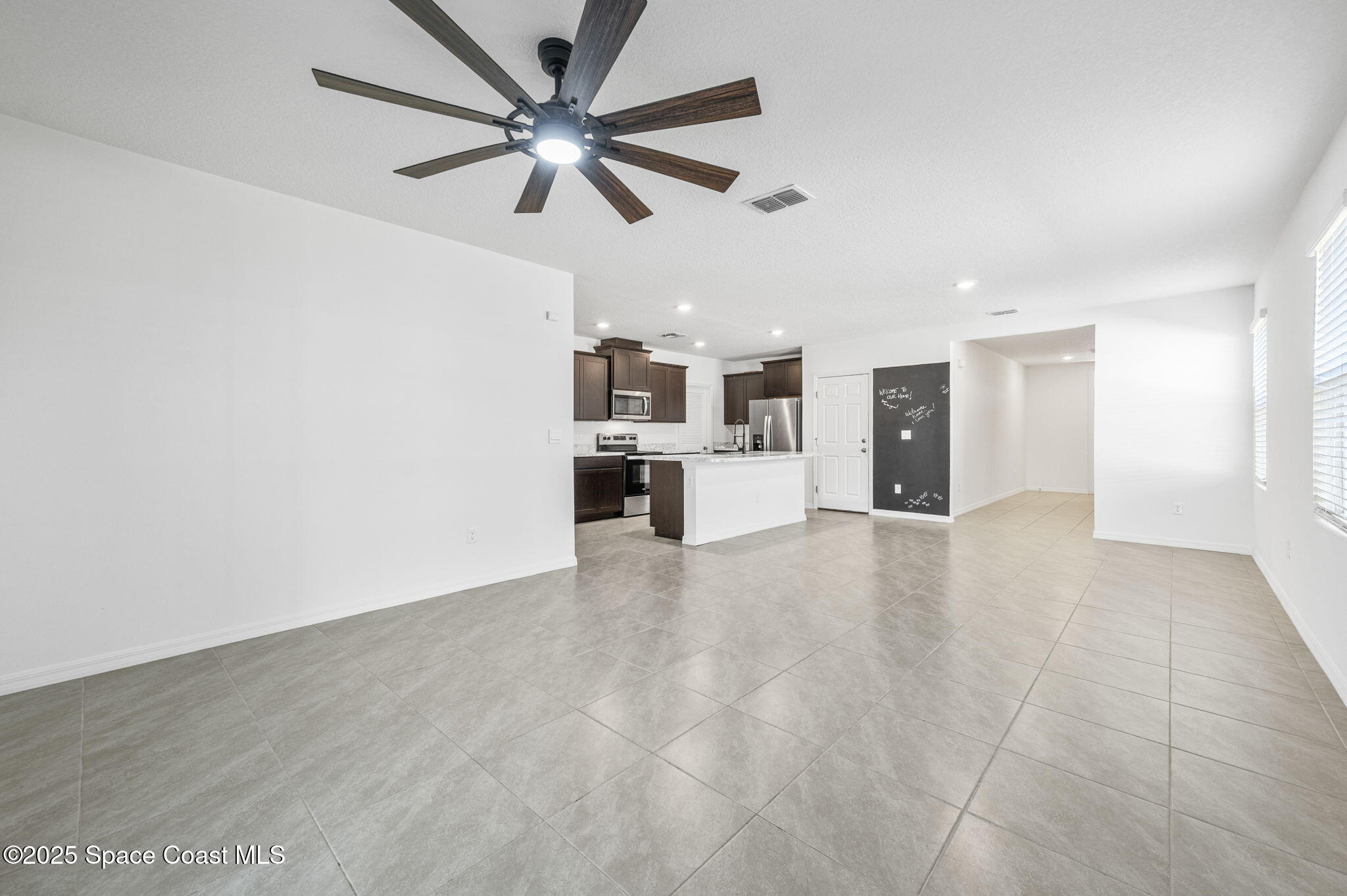 1217 Casey Avenue Rockledge, FL 32955 - Photo 7 of 49 a view of a livingroom with a kitchen