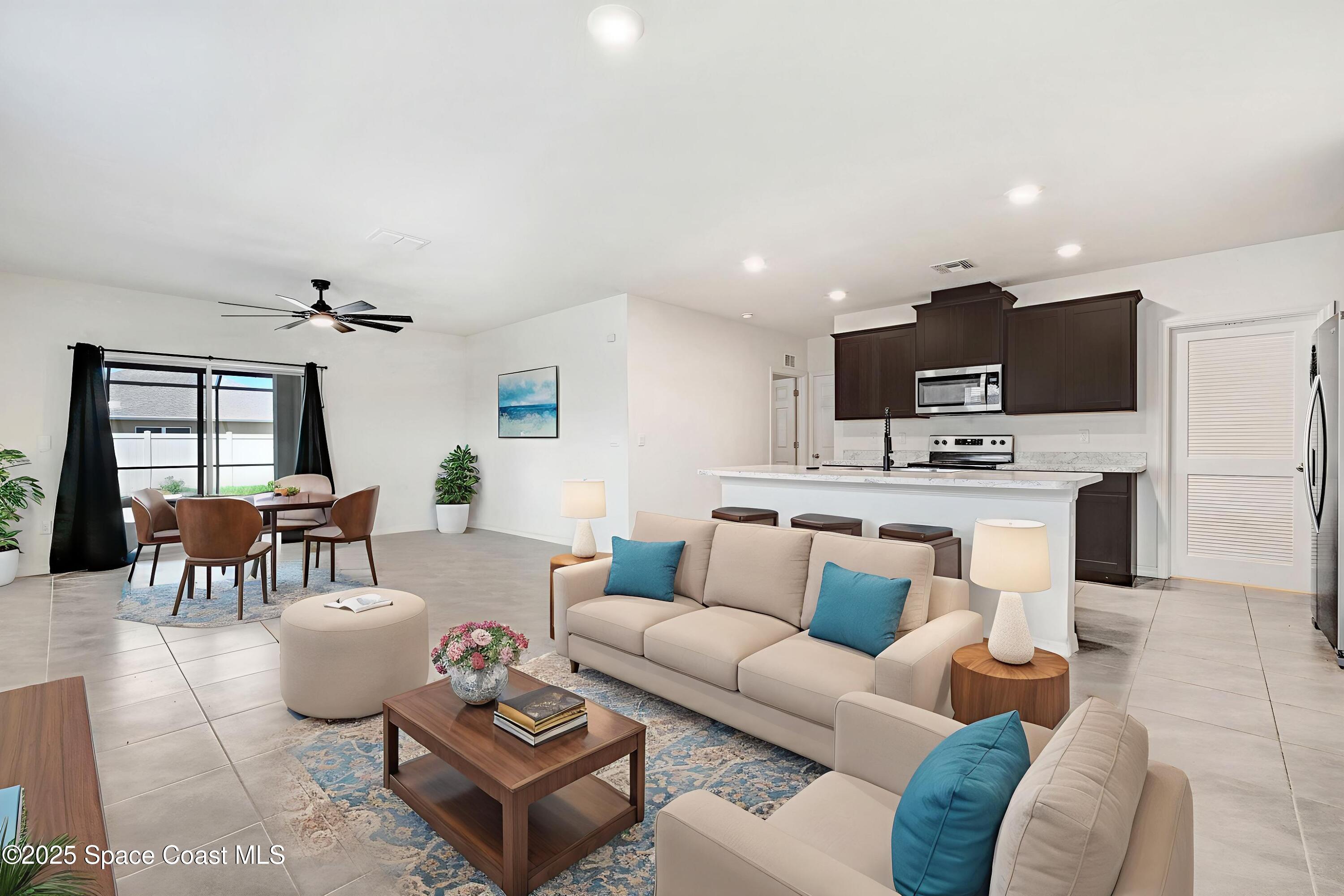 1217 Casey Avenue Rockledge, FL 32955 - Photo 10 of 49 a living room with furniture and a view of kitchen