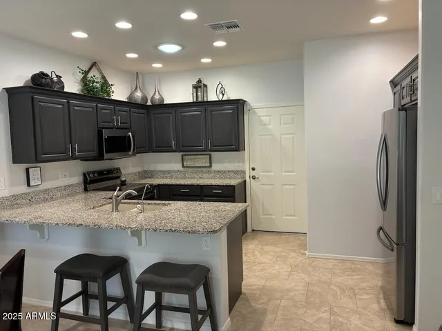 a living room with granite countertop furniture and a large window
