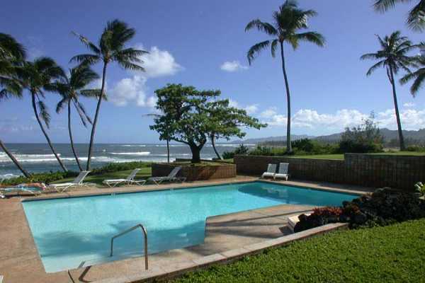 366 Papaloa Road, Unit 1C Kapaa, HI 96746 - Photo 2 of 11 a view of a lake with a table and chairs