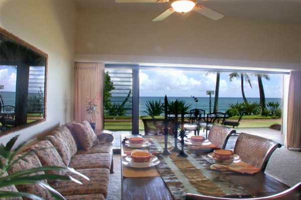366 Papaloa Road, Unit 1C Kapaa, HI 96746 - Photo 3 of 11 a living room with furniture and a large window