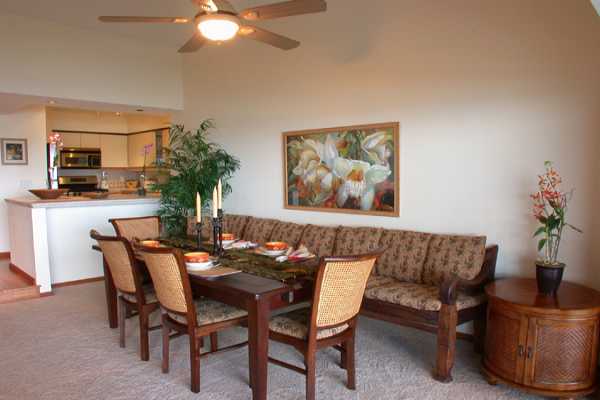 366 Papaloa Road, Unit 1C Kapaa, HI 96746 - Photo 5 of 11 a view of a dining room with furniture and a potted plant